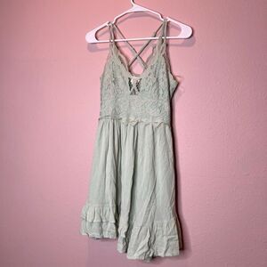 Entro Crochet Lace Mini Dress in sage green, featuring a crinkle fabric ruffle t
